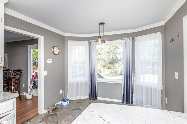 dining area with crown molding and hardwood / wood-style flooring