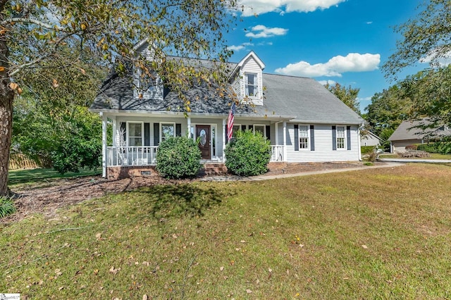 new england style home featuring a porch and a front lawn