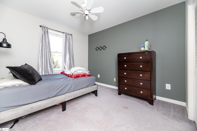 bedroom featuring light colored carpet and ceiling fan