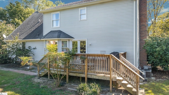 back of property featuring central AC and a wooden deck