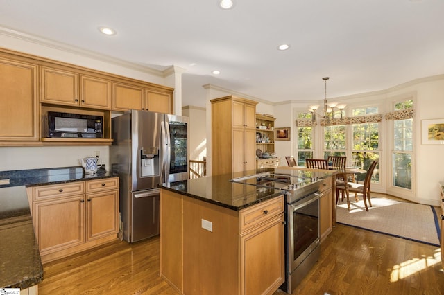 kitchen with a kitchen island, dark hardwood / wood-style flooring, stainless steel appliances, pendant lighting, and ornamental molding