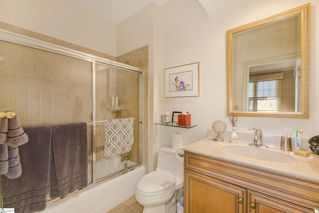 full bathroom with toilet, bath / shower combo with glass door, and vanity