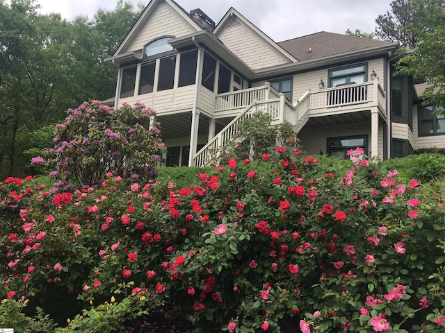 back of property featuring a sunroom