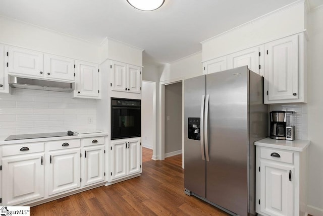 kitchen with white cabinetry, backsplash, black appliances, and dark hardwood / wood-style floors