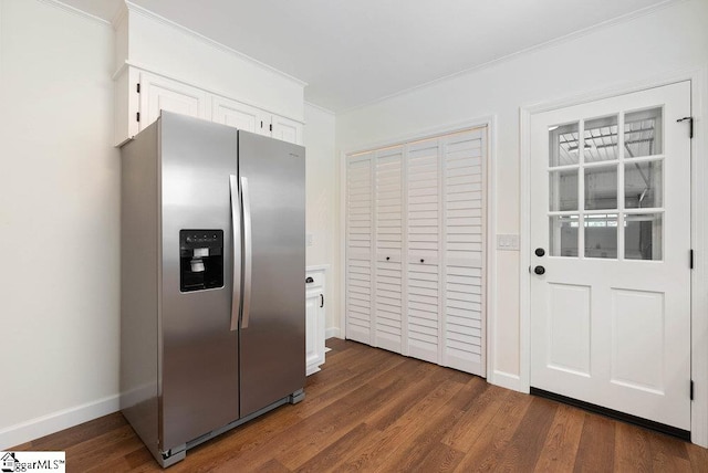 kitchen featuring crown molding, white cabinets, stainless steel refrigerator with ice dispenser, and dark hardwood / wood-style flooring