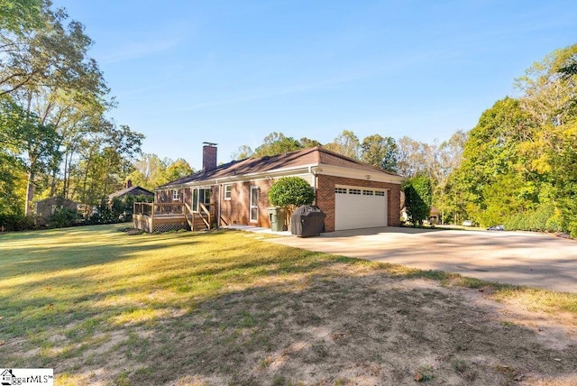 view of front of home with a wooden deck, a garage, and a front lawn