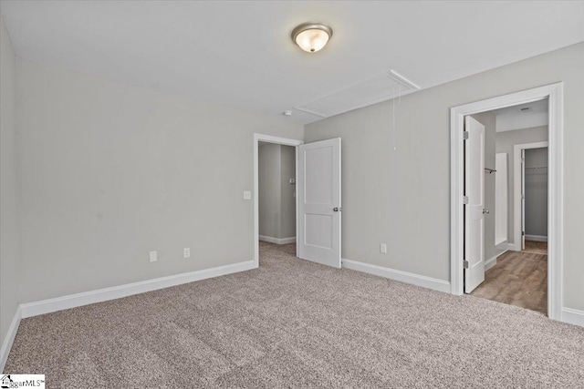 unfurnished bedroom with light colored carpet