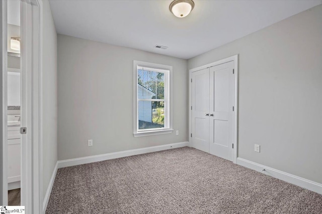 101A Mountain View Ave, Greer, SC 29650 - unfurnished bedroom with carpet flooring, baseboards, and a closet