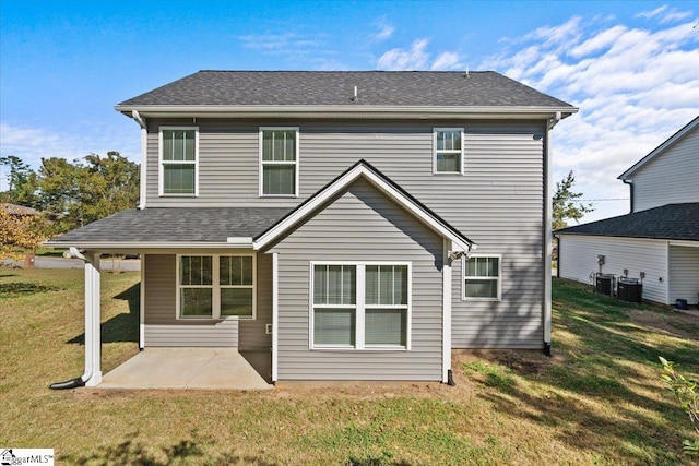 back of house with a patio, a lawn, and central AC unit