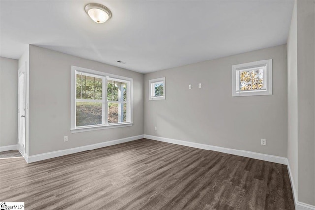 spare room with wood-type flooring