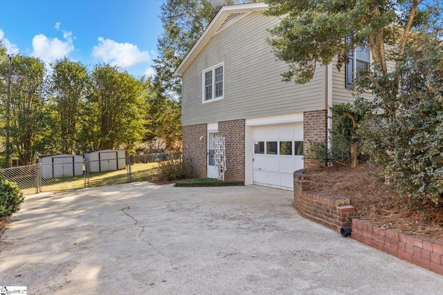 view of side of home featuring a garage