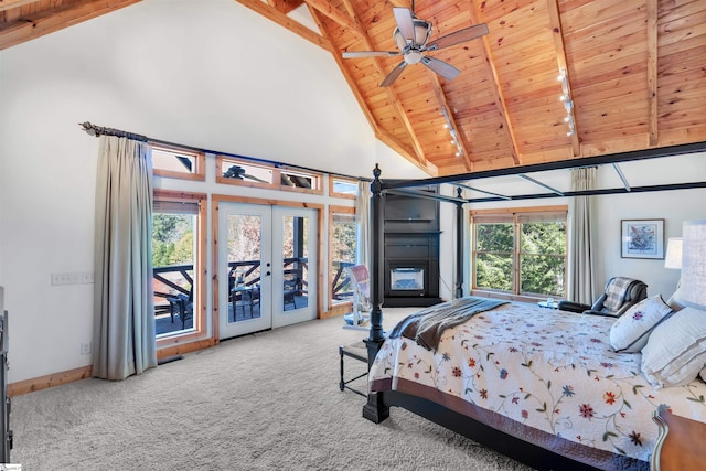 carpeted bedroom with ceiling fan, access to exterior, wooden ceiling, beamed ceiling, and french doors