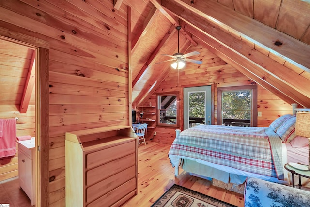 bedroom featuring wood walls, light wood-type flooring, lofted ceiling with beams, ceiling fan, and wooden ceiling