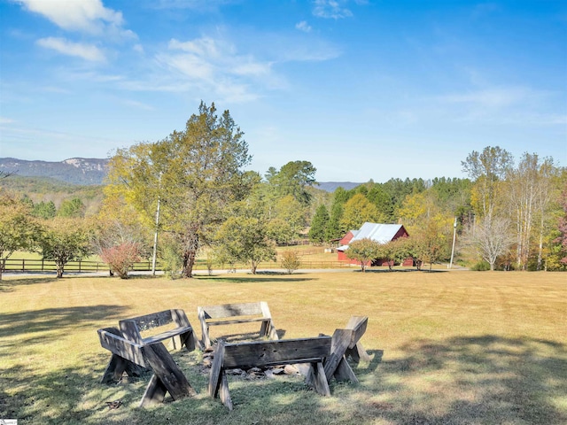 view of yard featuring a mountain view and a rural view