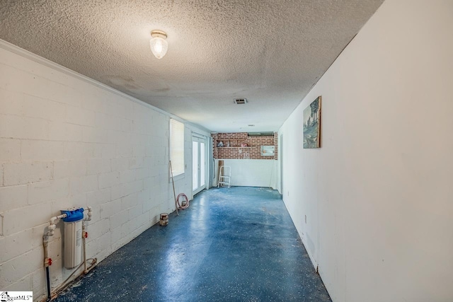 hall with a textured ceiling