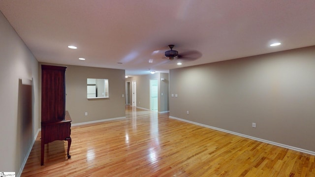 spare room with light hardwood / wood-style floors and ceiling fan