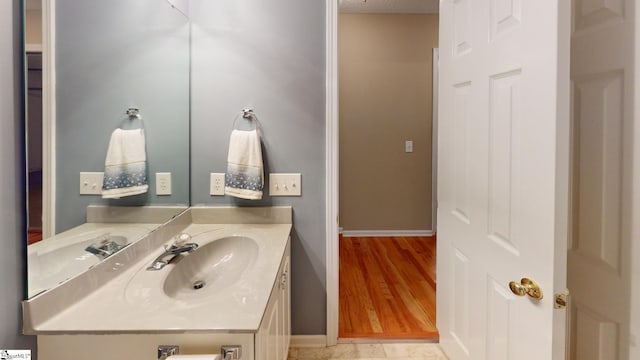 bathroom featuring vanity and wood-type flooring