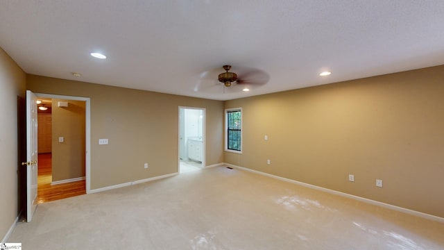 carpeted empty room with ceiling fan