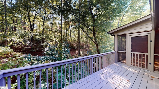 deck with a sunroom