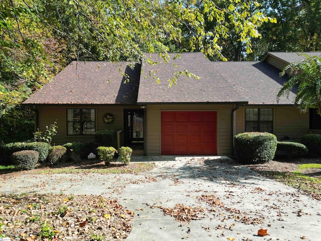 single story home with a garage