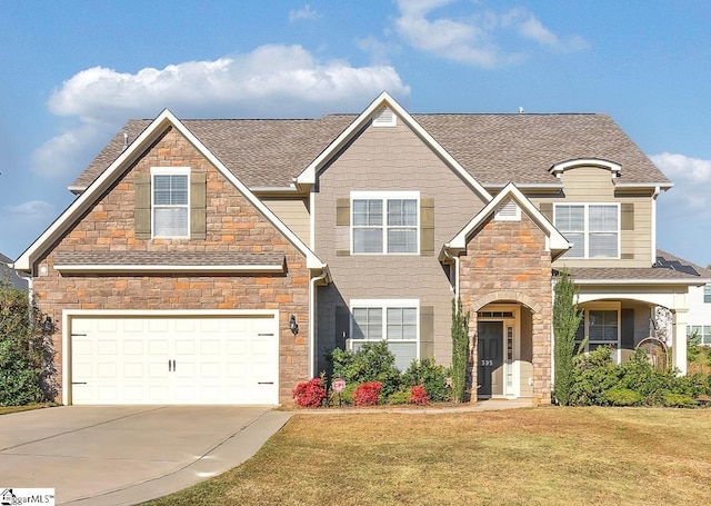 view of front of house with a garage and a front lawn