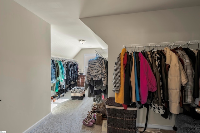 spacious closet featuring carpet and lofted ceiling