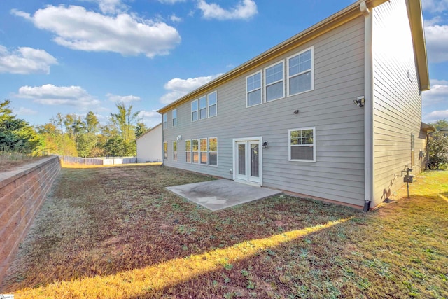 rear view of property with french doors and a patio area