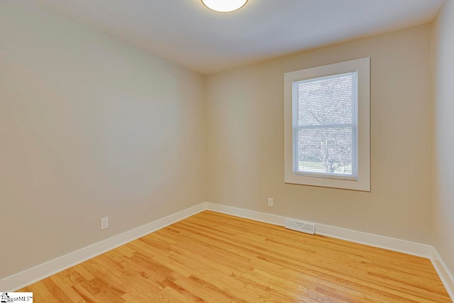 empty room with light hardwood / wood-style floors