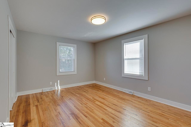 unfurnished room featuring light hardwood / wood-style flooring