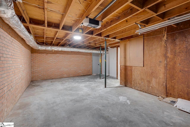 basement with brick wall