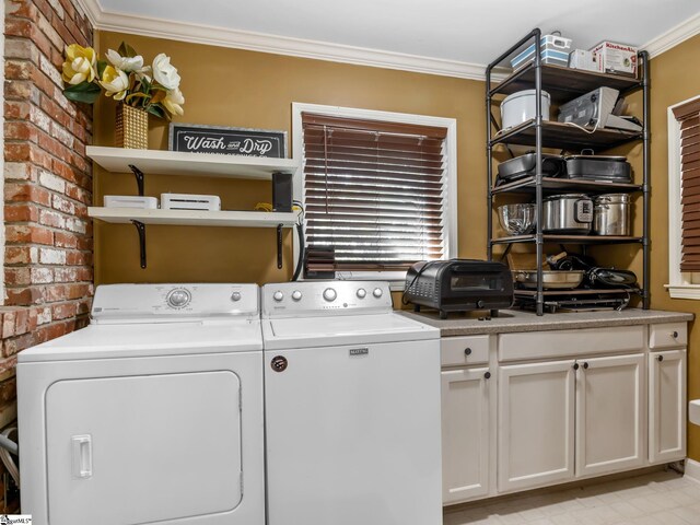 248 Greengate Ln, Spartanburg, SC 29307 - laundry area featuring ornamental molding, cabinet space, washing machine and clothes dryer, and brick wall