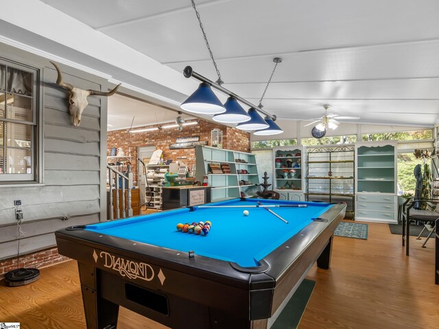 game room featuring pool table, wood-type flooring, brick wall, and ceiling fan