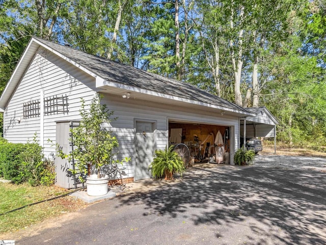 view of side of property featuring a carport