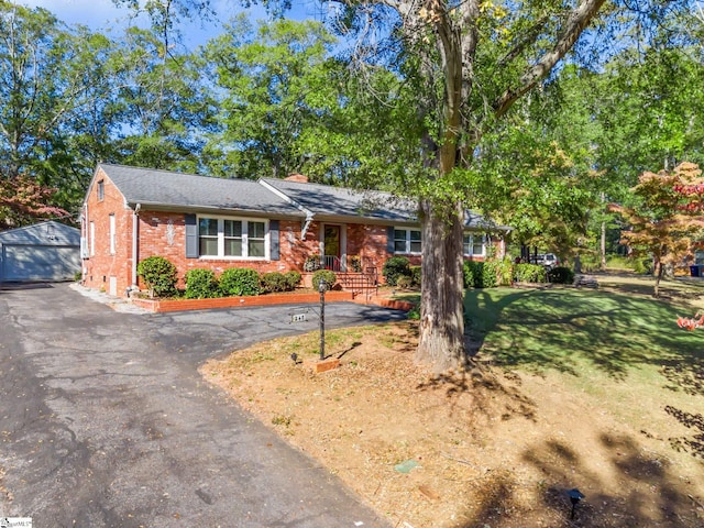 248 Greengate Ln, Spartanburg, SC 29307 - ranch-style house featuring a front lawn, brick siding, an outdoor structure, driveway, and a chimney