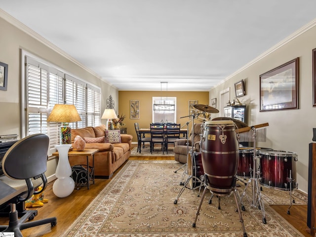 office space with ornamental molding and light hardwood / wood-style floors