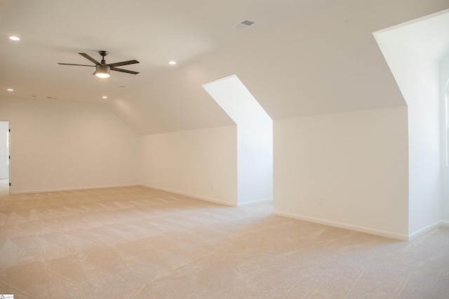 bonus room featuring ceiling fan, light carpet, and lofted ceiling