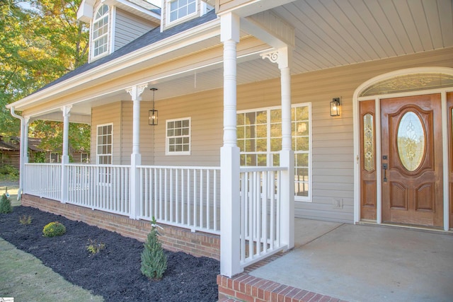 property entrance featuring covered porch