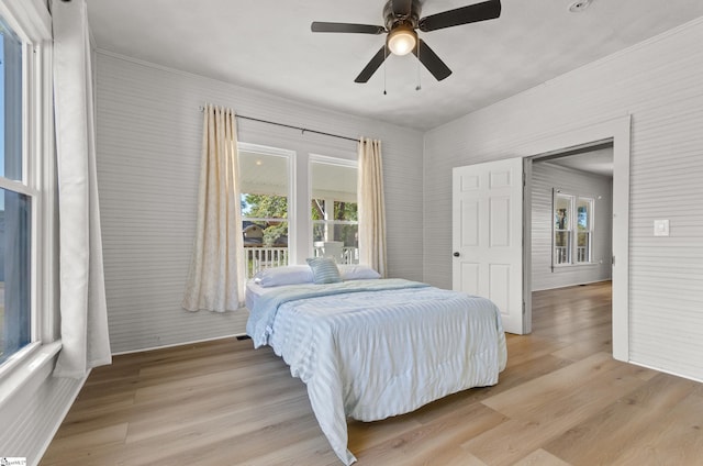 bedroom featuring light hardwood / wood-style floors and ceiling fan