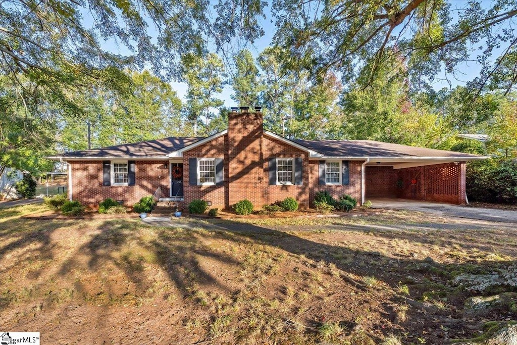 single story home featuring a carport