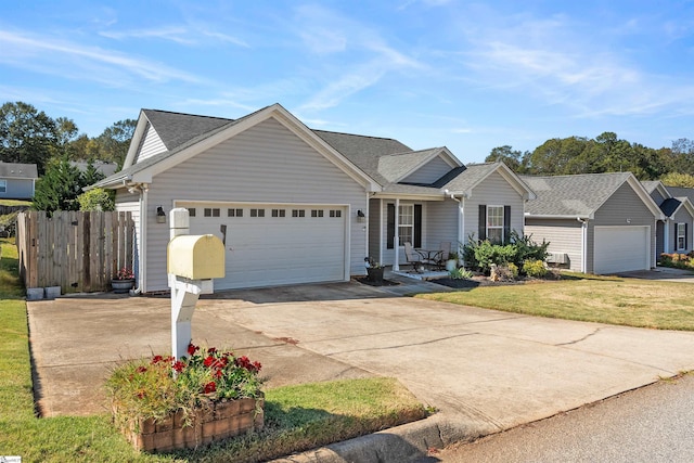 single story home with a front yard and a garage