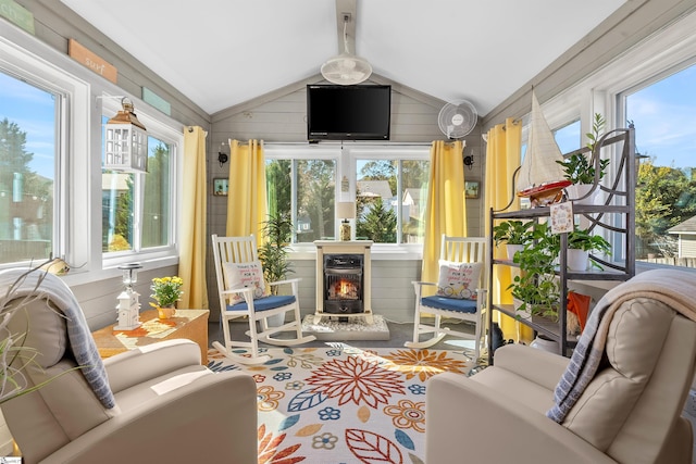 sunroom / solarium with vaulted ceiling with beams and a healthy amount of sunlight