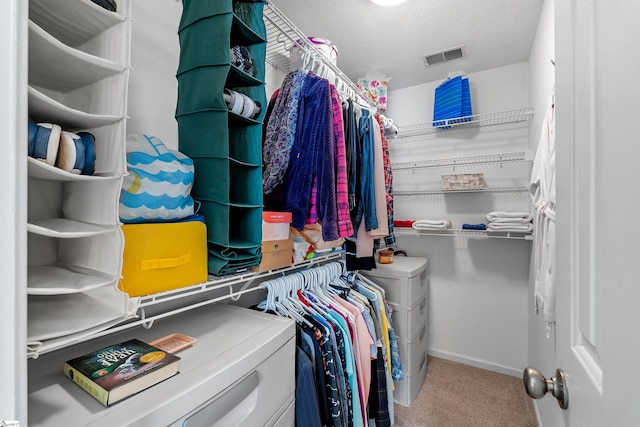 spacious closet with carpet floors