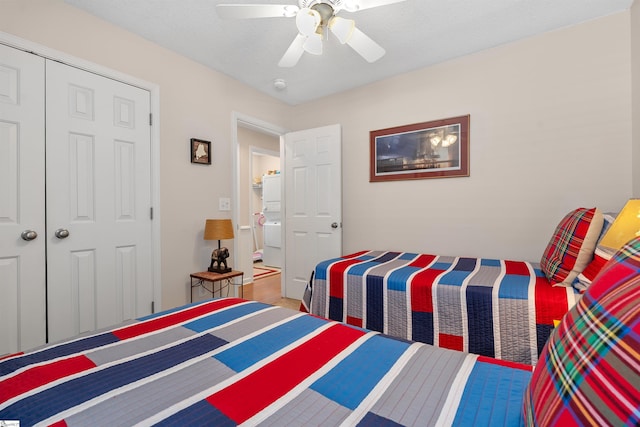 bedroom with a textured ceiling, a closet, and ceiling fan