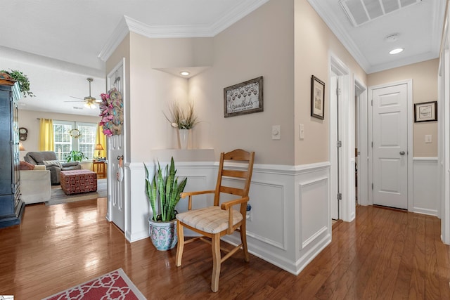 corridor with crown molding and hardwood / wood-style flooring