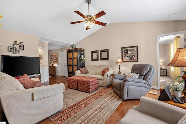 living room with lofted ceiling, hardwood / wood-style flooring, and ceiling fan