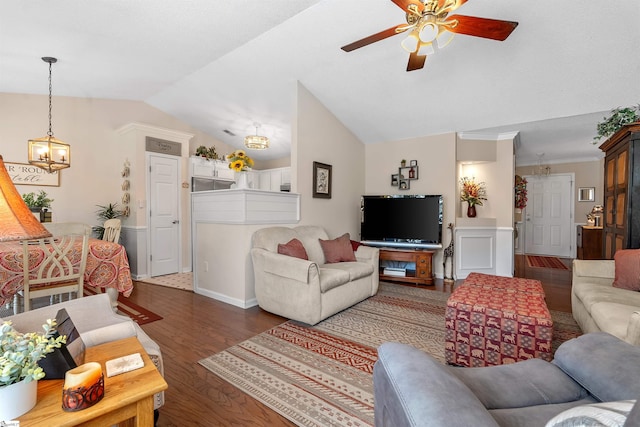 living room with dark hardwood / wood-style flooring, ceiling fan with notable chandelier, and vaulted ceiling