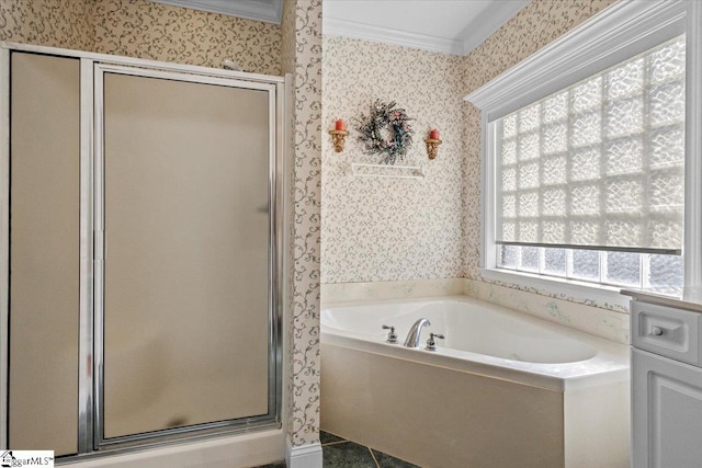 bathroom featuring crown molding and separate shower and tub