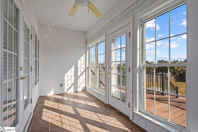 sunroom / solarium with ceiling fan