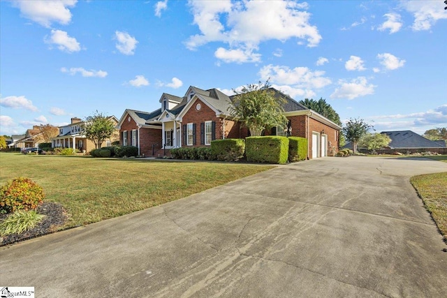 view of front of house featuring a front lawn and a garage