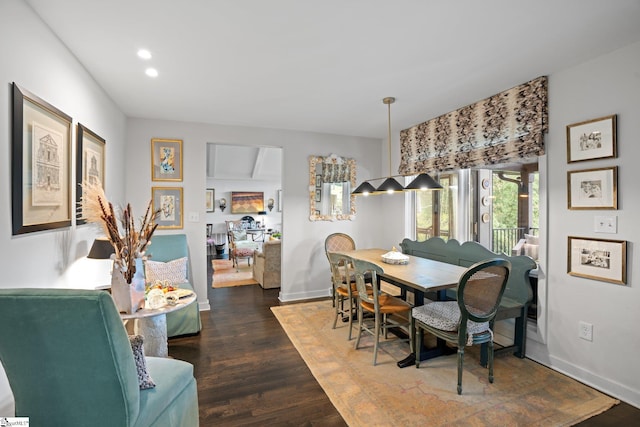 dining area featuring dark hardwood / wood-style floors